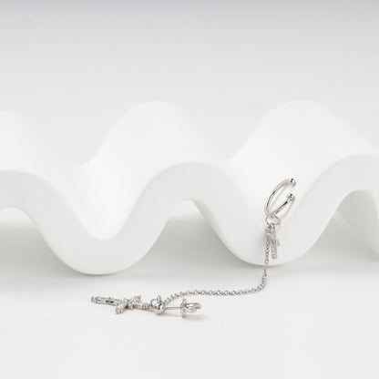 Silver 925 cross earring with chain and ear cuff, flat view — Kabluchka