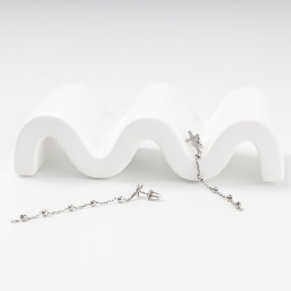 Cross drop earrings in rhodium-plated silver, detail view — Kabluchka