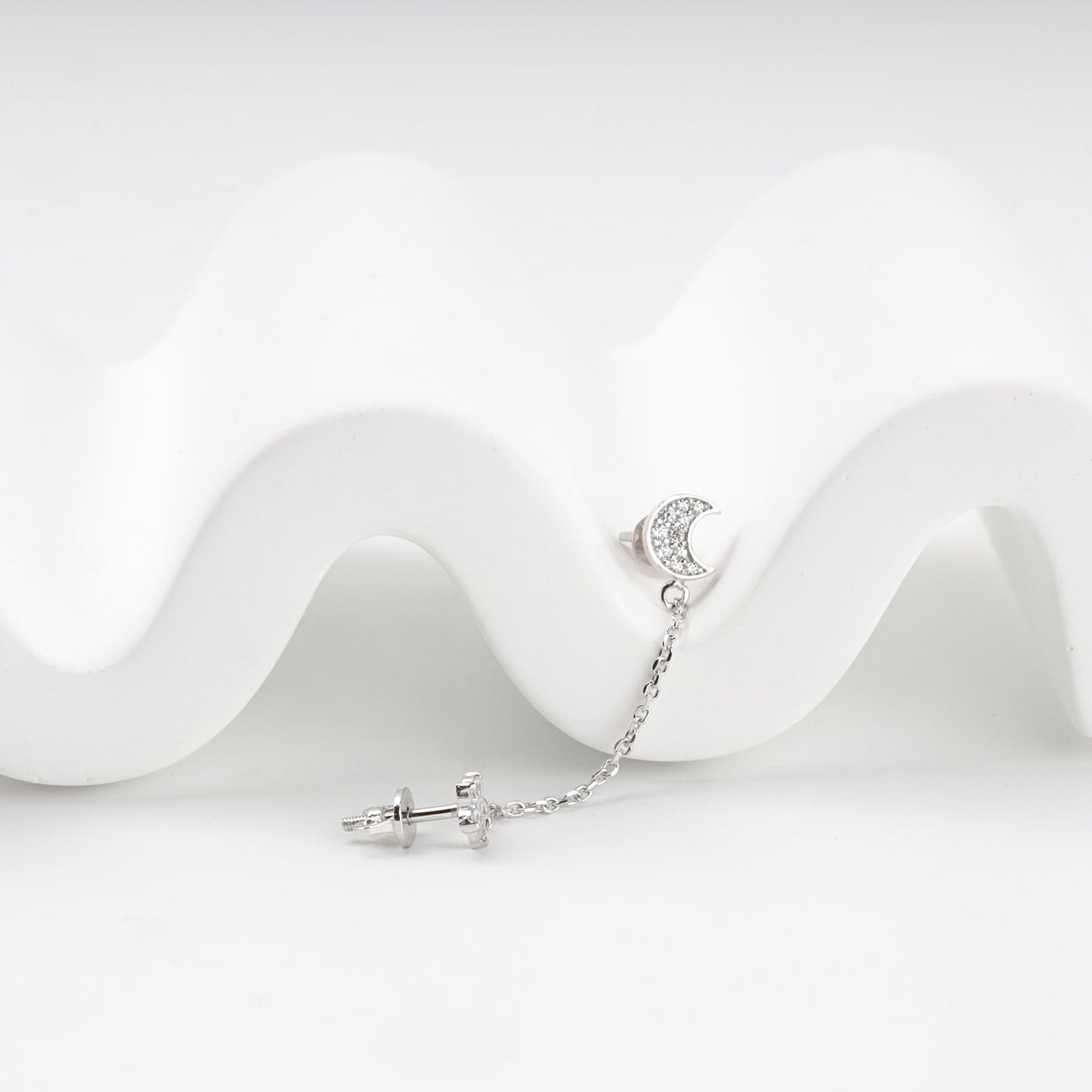 Close-up of the pavé crescent moon stud with screw-back post — Kabluchka