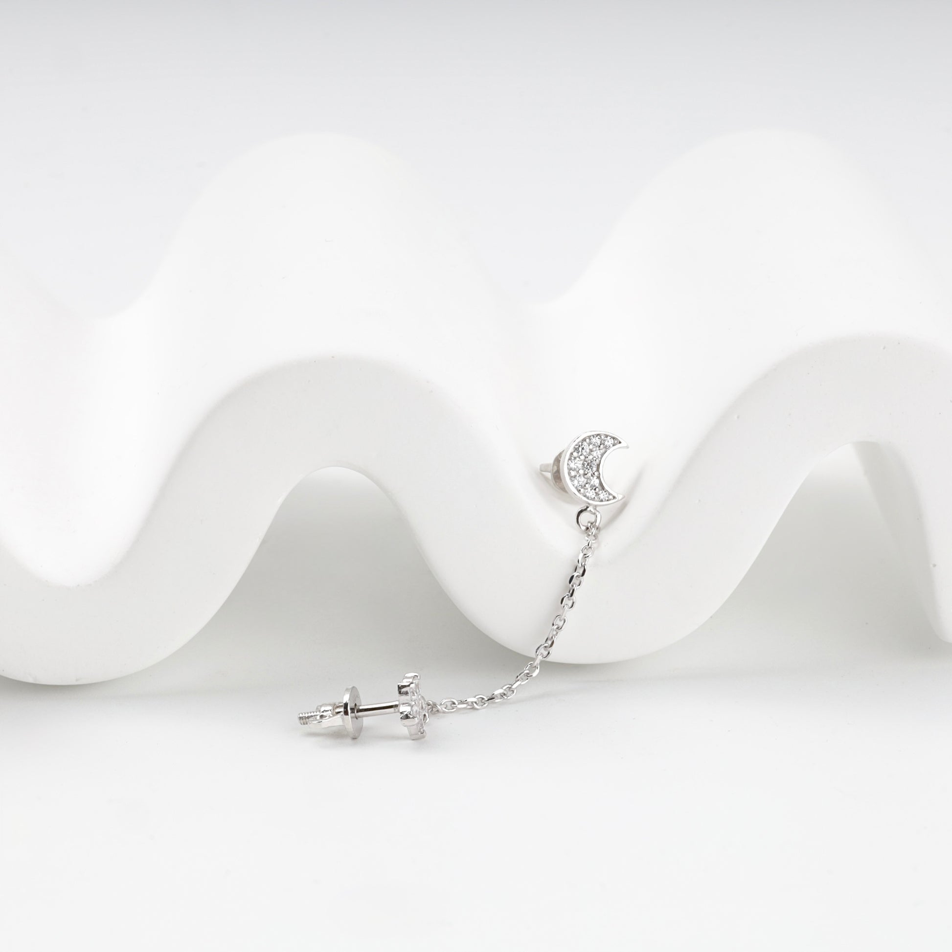 Close-up of the pavé crescent moon stud with screw-back post — Kabluchka