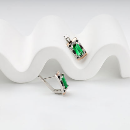 Side view of green alpinite earrings with gold accents