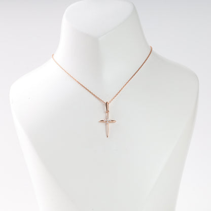 Rose gold cross pendant with cubic zirconia on mannequin — Kabluchka Jewelry Store