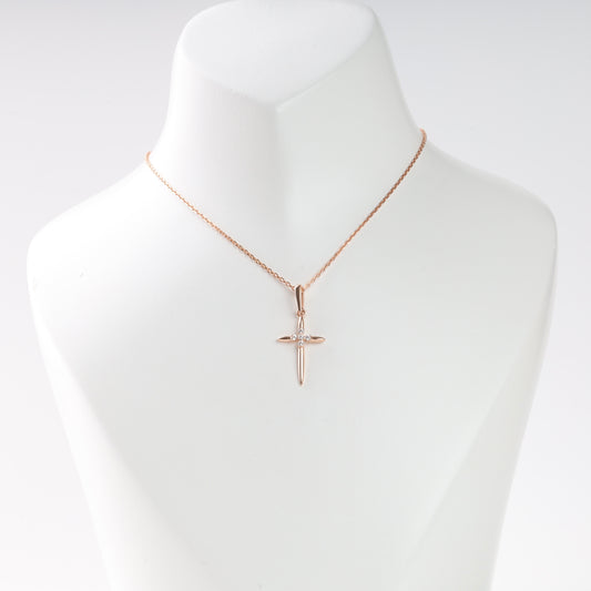 Rose gold cross pendant with cubic zirconia on mannequin — Kabluchka Jewelry Store