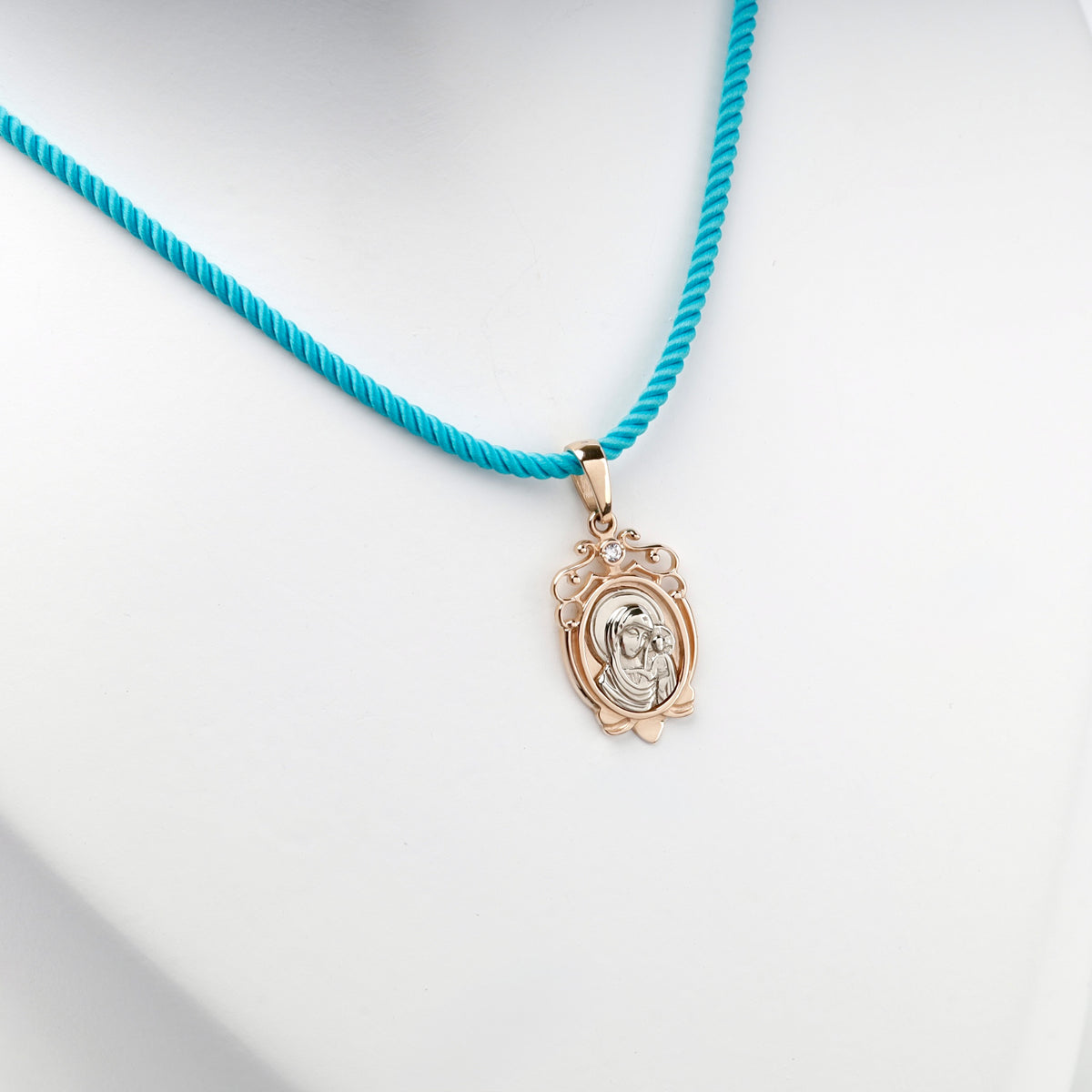 Ornate rose and white gold religious pendant with clear cubic zirconia