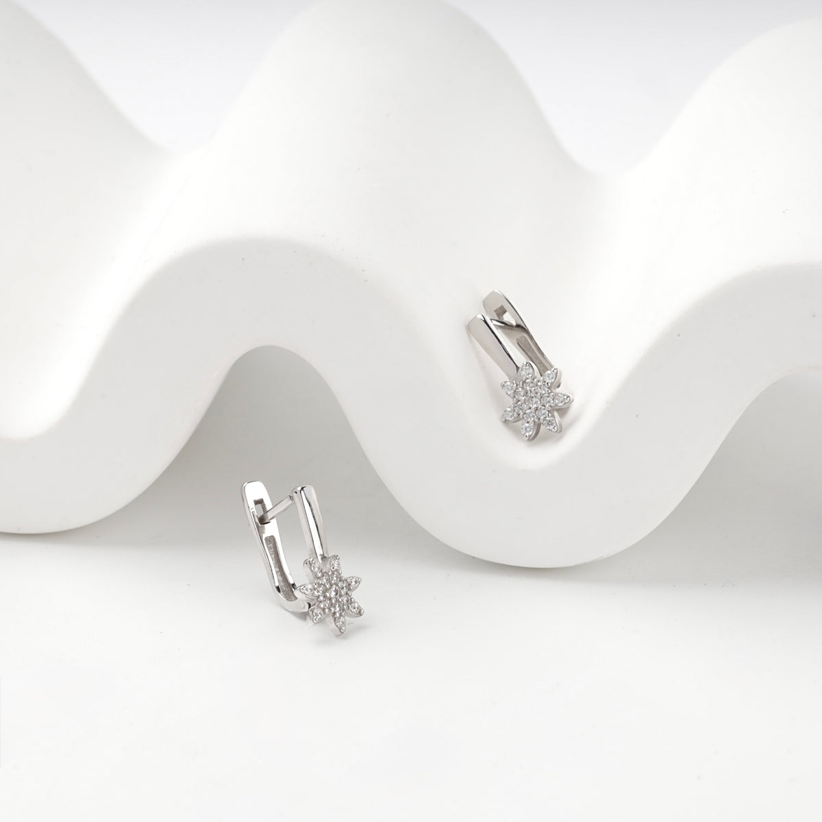 Silver 925 cubic zirconia star earrings on display — angled view — Kabluchka