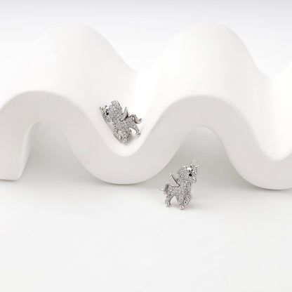 Cubic zirconia winged unicorn earrings, angled view
