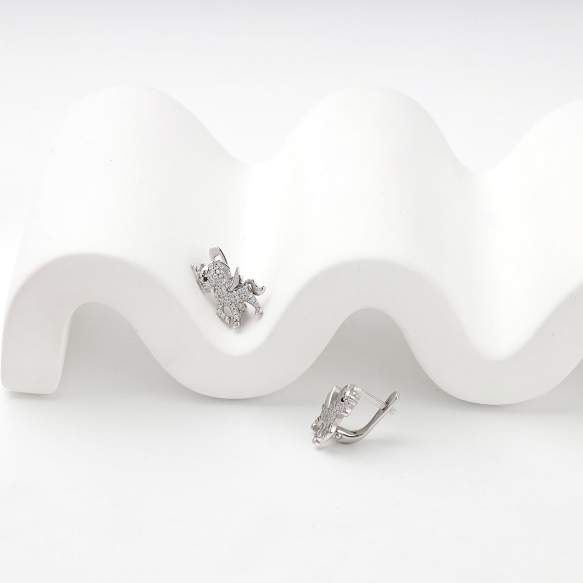 Silver 925 unicorn earrings showing front and side profile