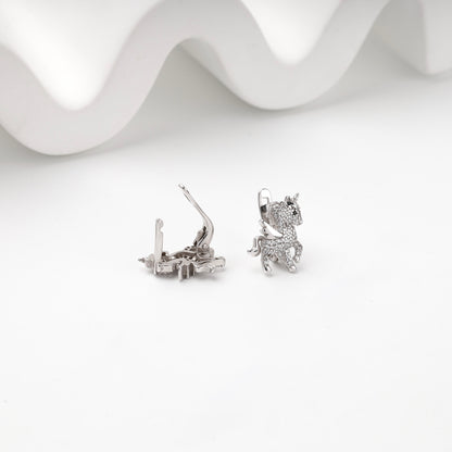Winged unicorn earrings with English-lock backs open