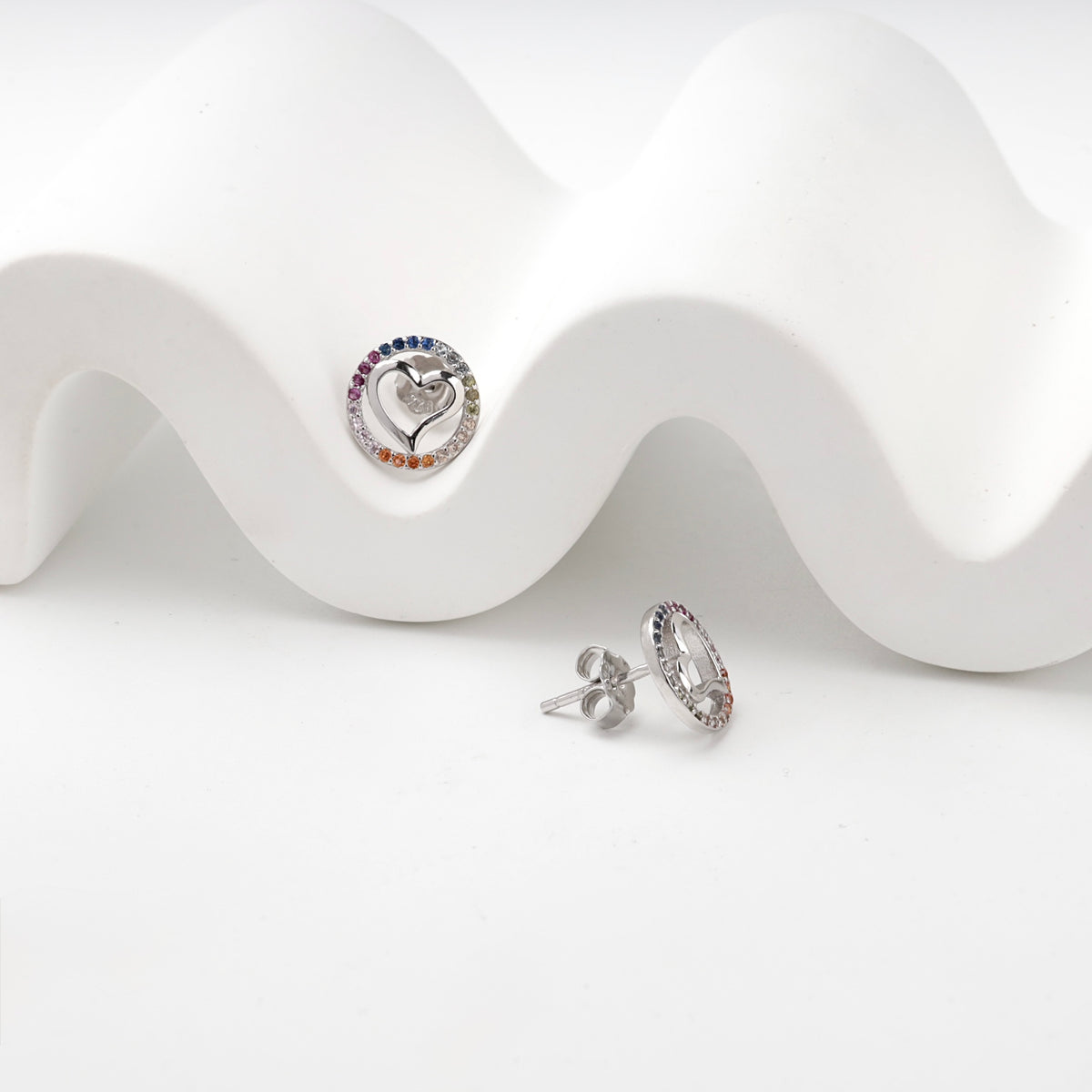 Multicolor cubic zirconia heart studs showing front and side profiles