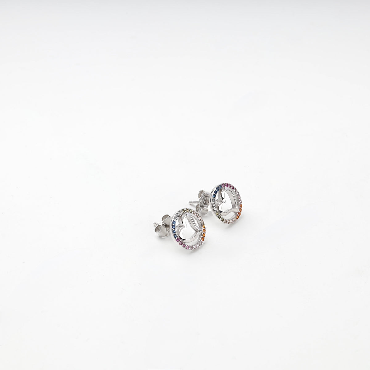 Multicolor cubic zirconia round heart stud earrings, angled view