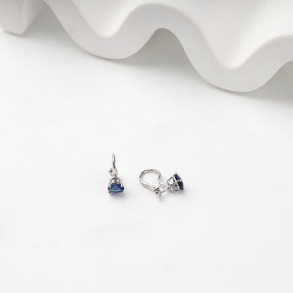 Silver hook earrings showing open prong settings
