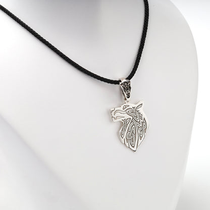 Openwork wolf head pendant with interlaced details, close view