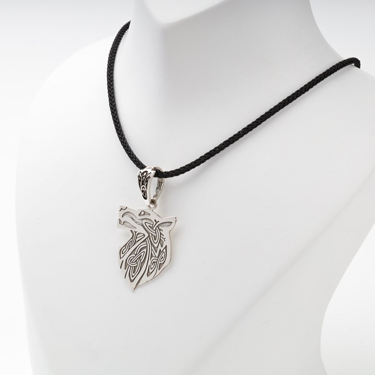 Silver 925 wolf head pendant on a black styling cord, not included