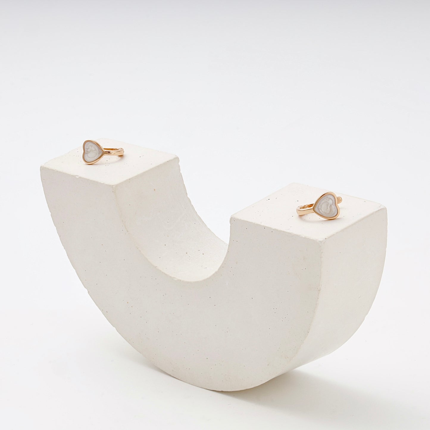 Children's Rose Gold 585 Heart Earrings with White Enamel — on arch stand — Kabluchka