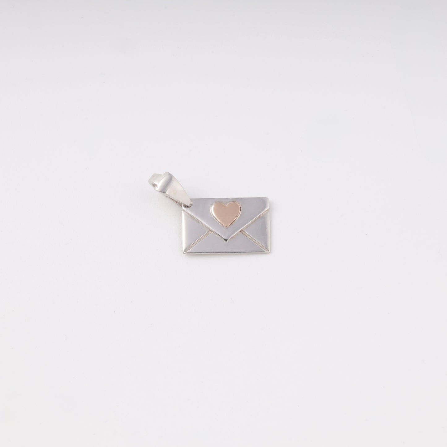 Silver 925 Envelope Pendant with Gold Heart flat lay — Kabluchka