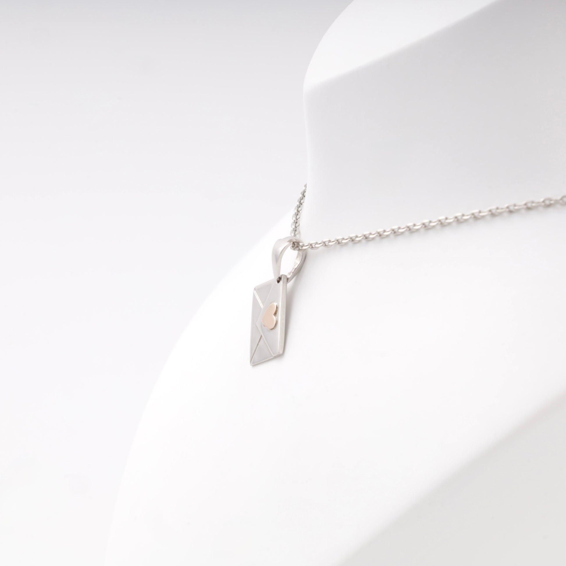 Silver 925 Envelope Pendant with Gold Heart on display — Kabluchka