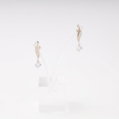 Silver 925 cubic zirconia twist drop earrings on a stand — Kabluchka