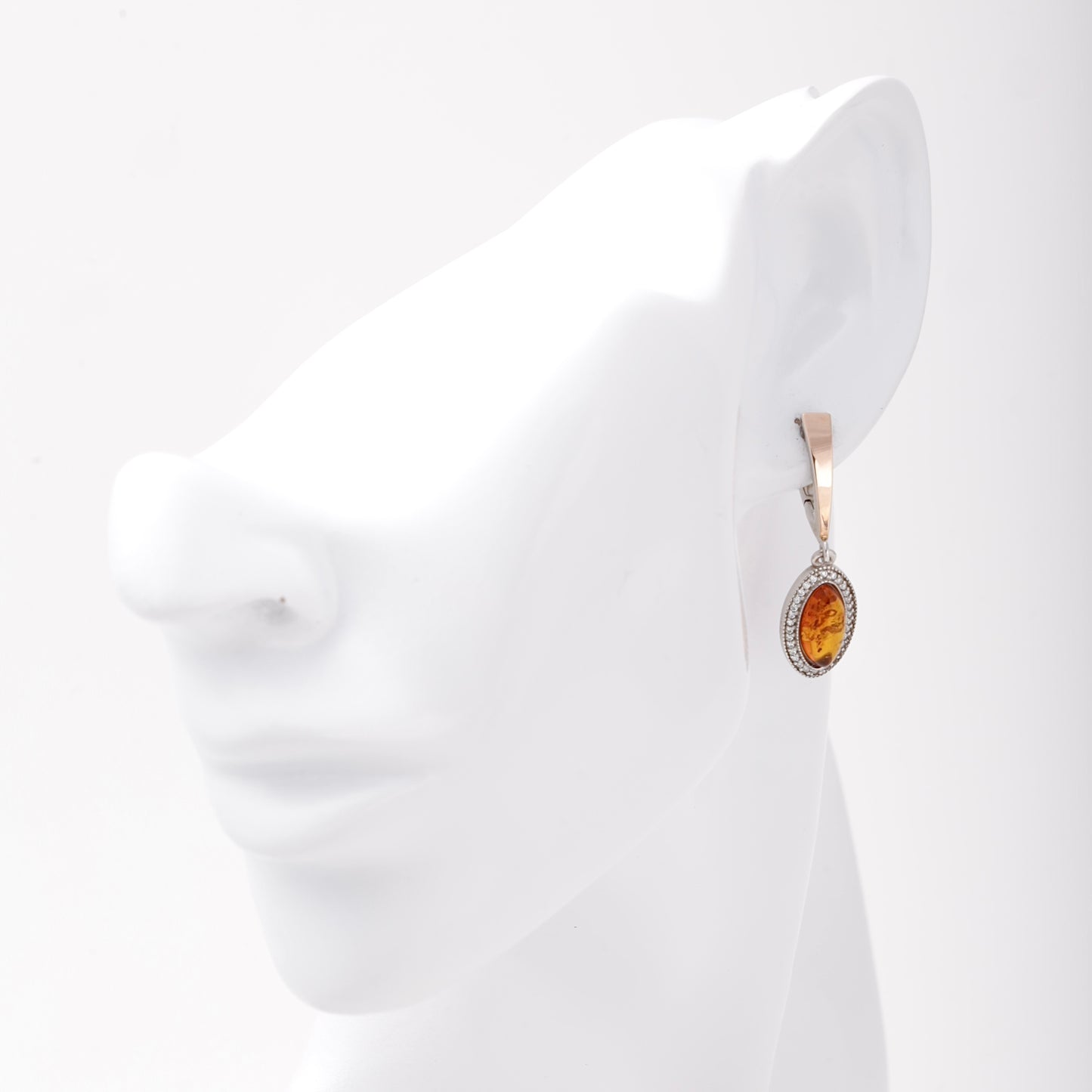 Silver 925 amber drop earring shown on ear model — Kabluchka