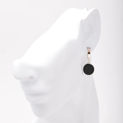 Silver 925 onyx drop earring shown on ear — Kabluchka
