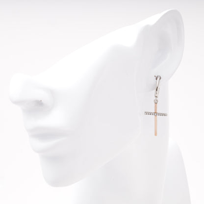 Silver 925 cross drop earring shown on ear — Kabluchka