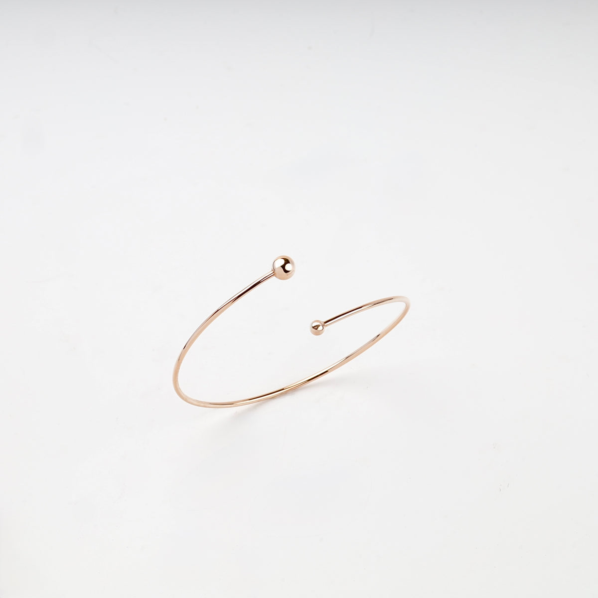 Rose Gold 14K asymmetric ball open bangle bracelet front view