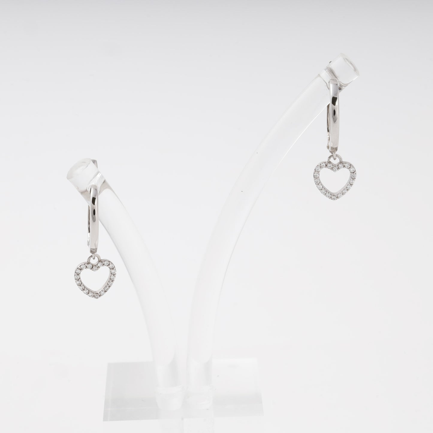 Silver 925 drop earrings with CZ heart charm on display stand, front view — Kabluchka