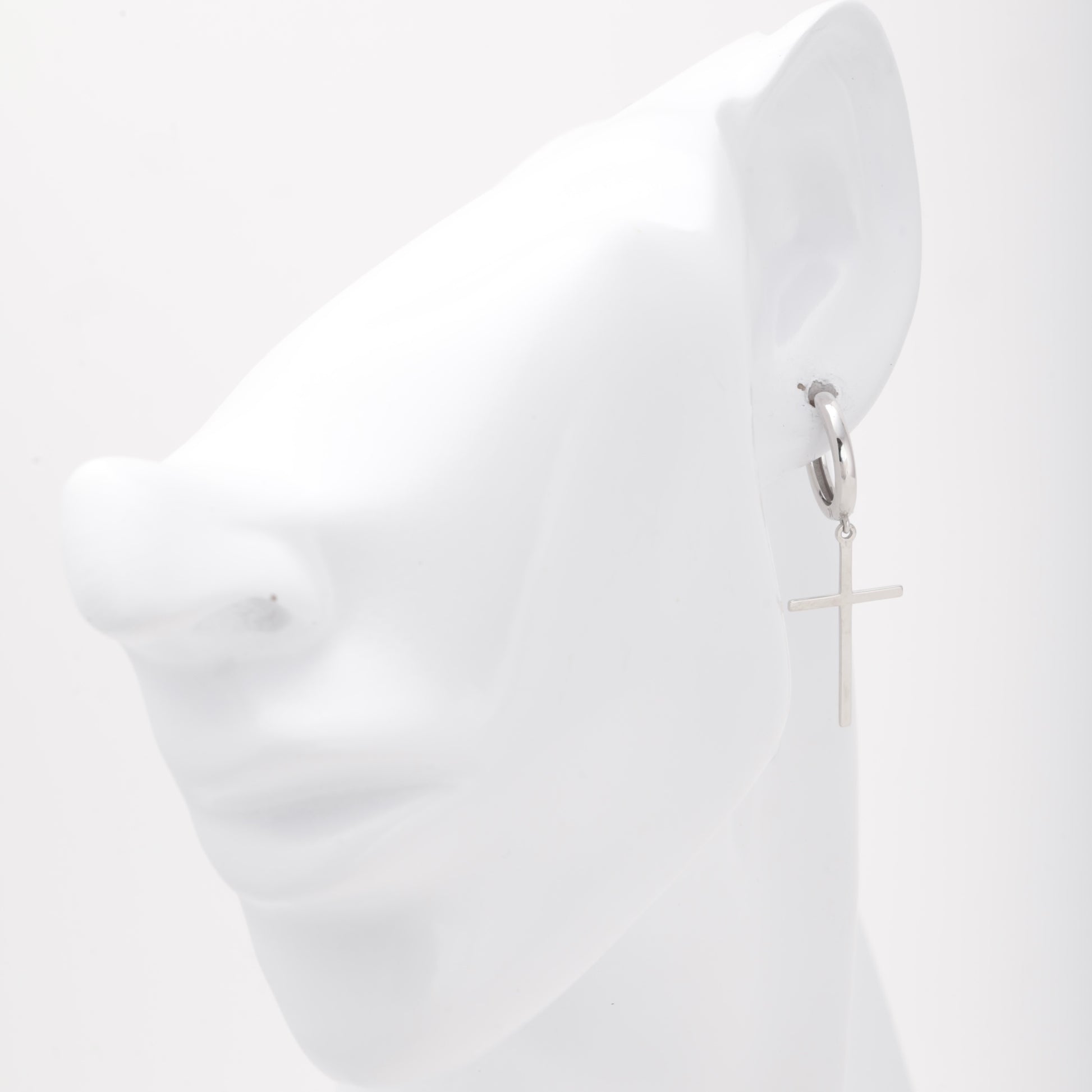 Silver 925 cross huggie hoop earring shown on ear model — Kabluchka