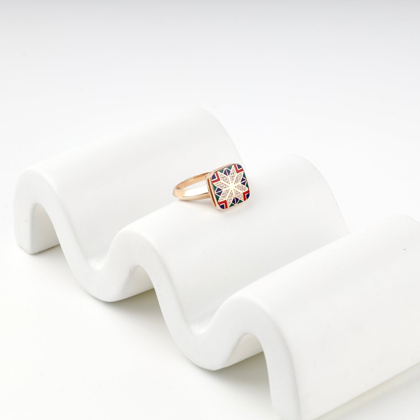 Geometric Ukrainian enamel ring with cubic zirconia border, close view