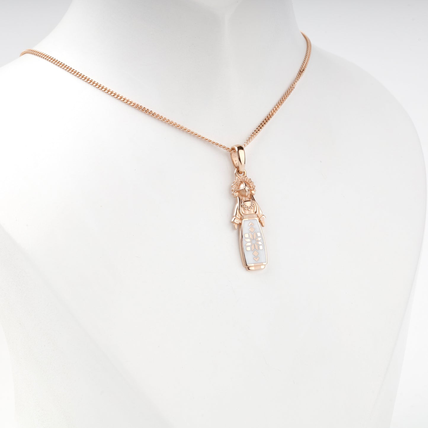 Rose Gold 14K white enamel motanka doll pendant, angled view