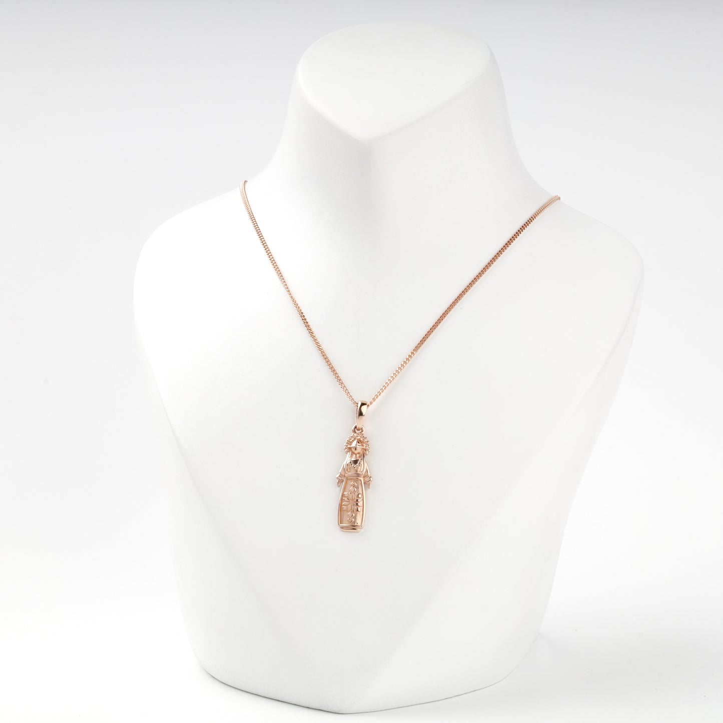 Ukrainian motanka doll pendant in rose gold, close view