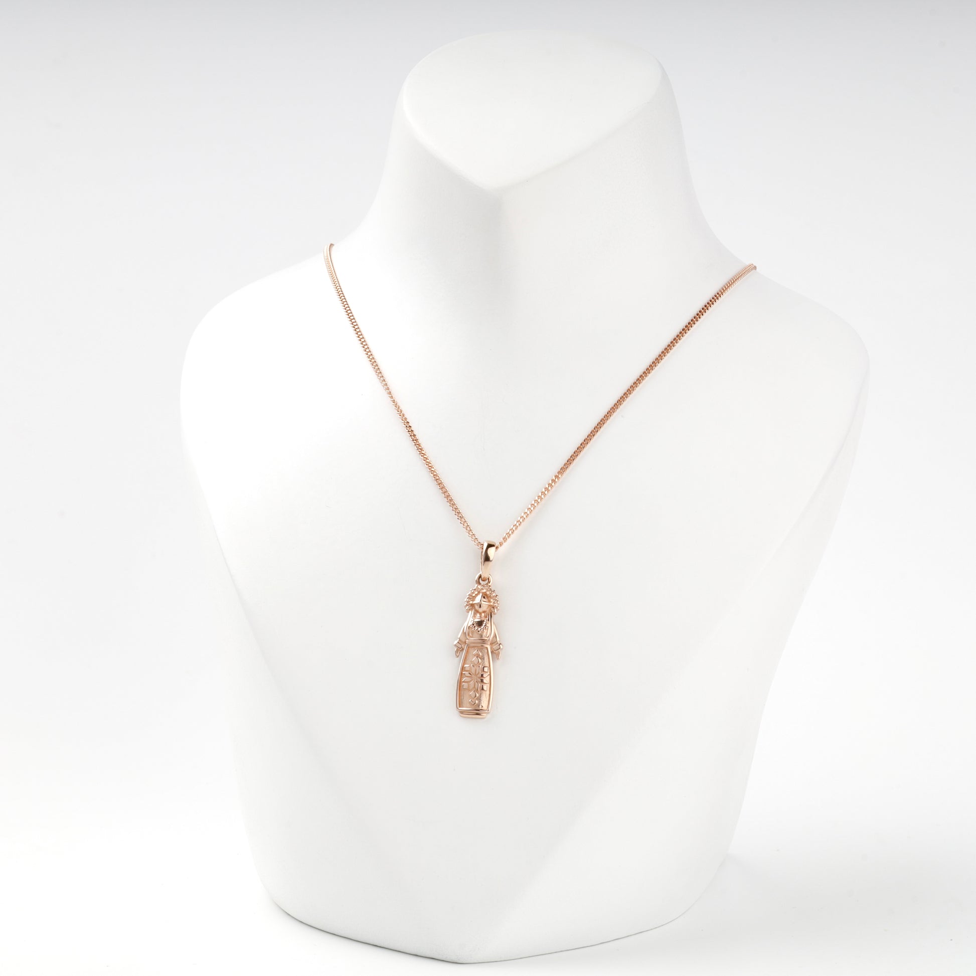 Ukrainian motanka doll pendant in rose gold, close view