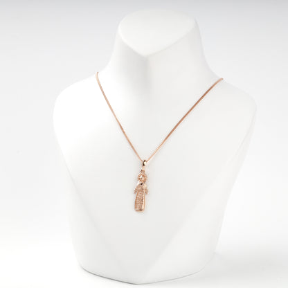 Ukrainian motanka doll pendant in rose gold, close view