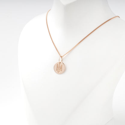 Raised Ukrainian Trident on a polished rose gold disc pendant
