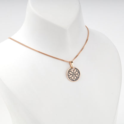 Rose Gold 14K eight-rayed ornamental pendant, angled view