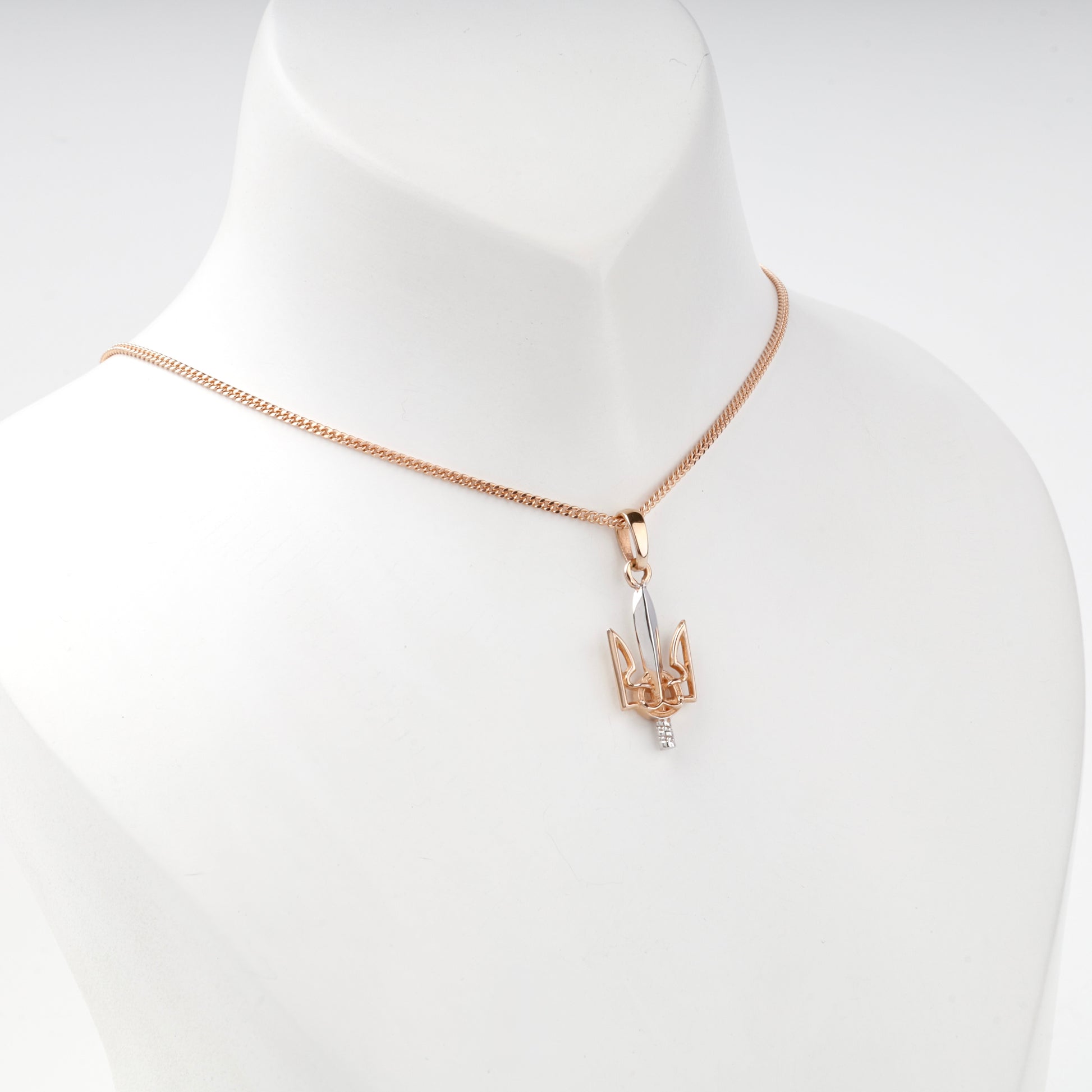 Two-tone Gold 14K Trident sword pendant, angled view