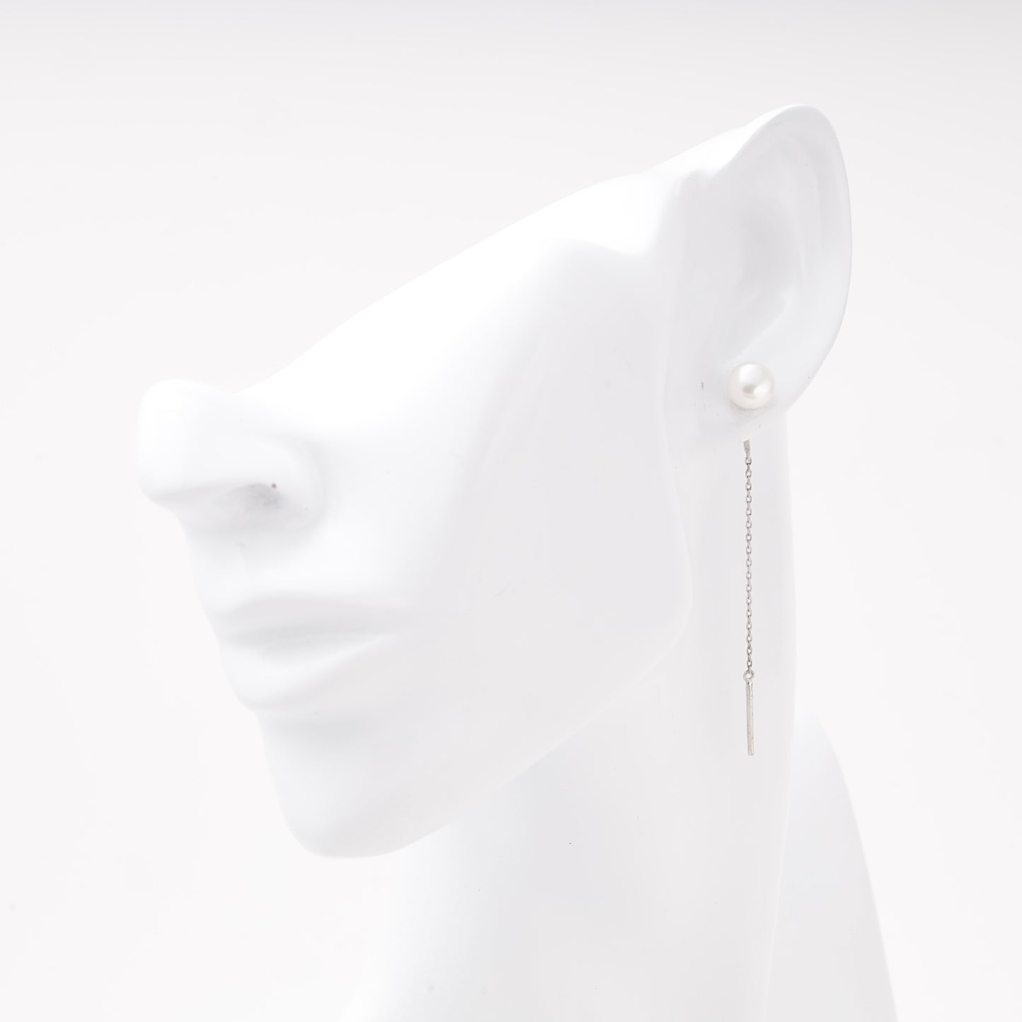 Silver 925 pearl threader earring shown on ear model — Kabluchka