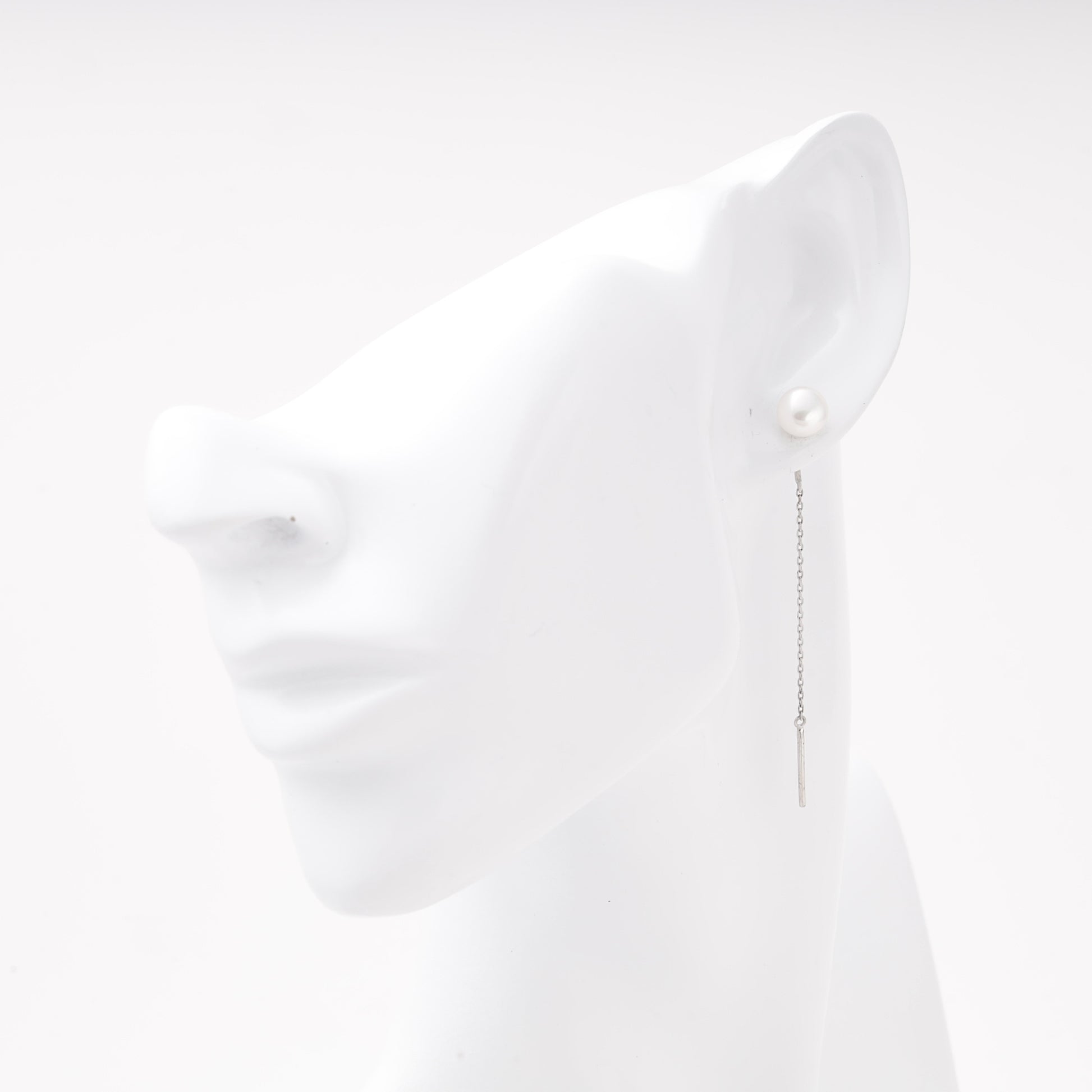 Silver 925 pearl threader earring shown on ear model — Kabluchka