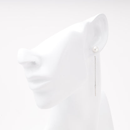 Silver 925 pearl threader earring shown on ear model — Kabluchka