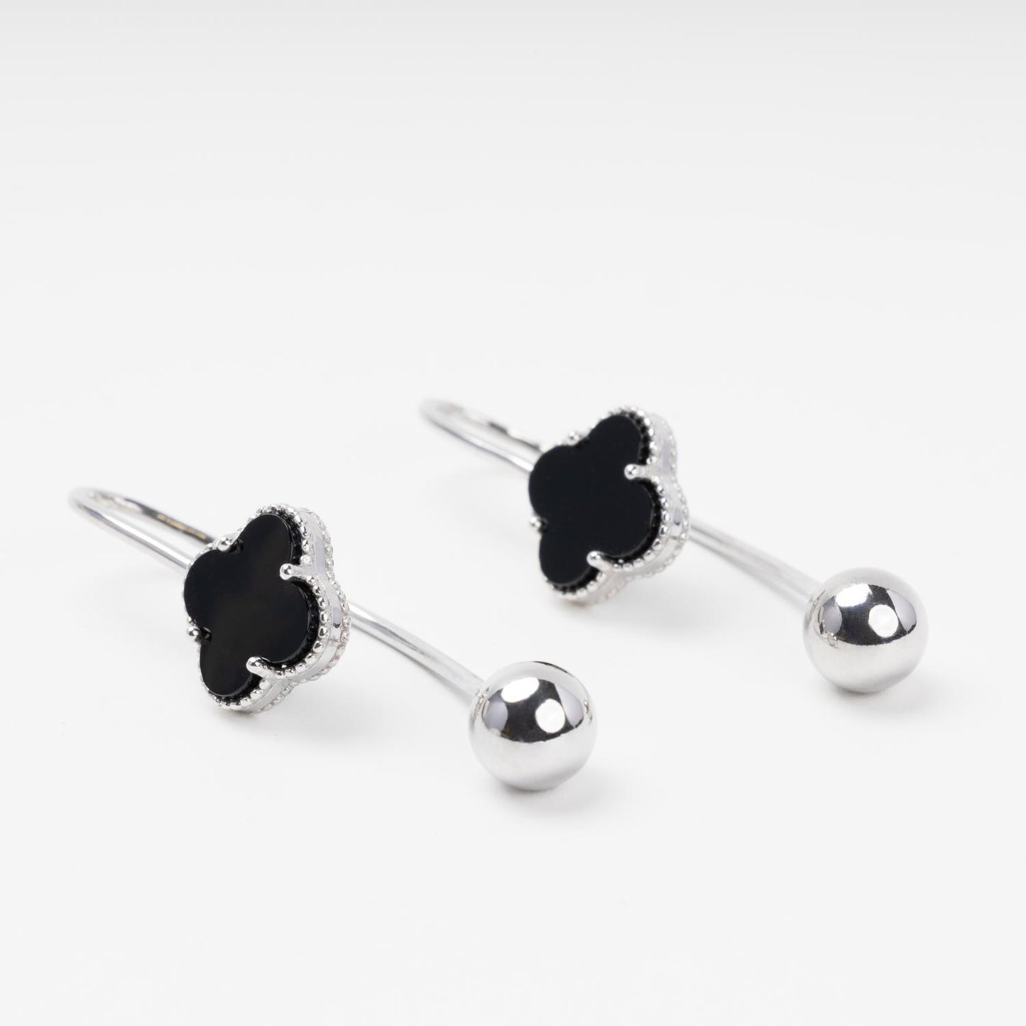 Silver hook earrings with black onyx clover macro shot | Jewelry Store Kabluchka