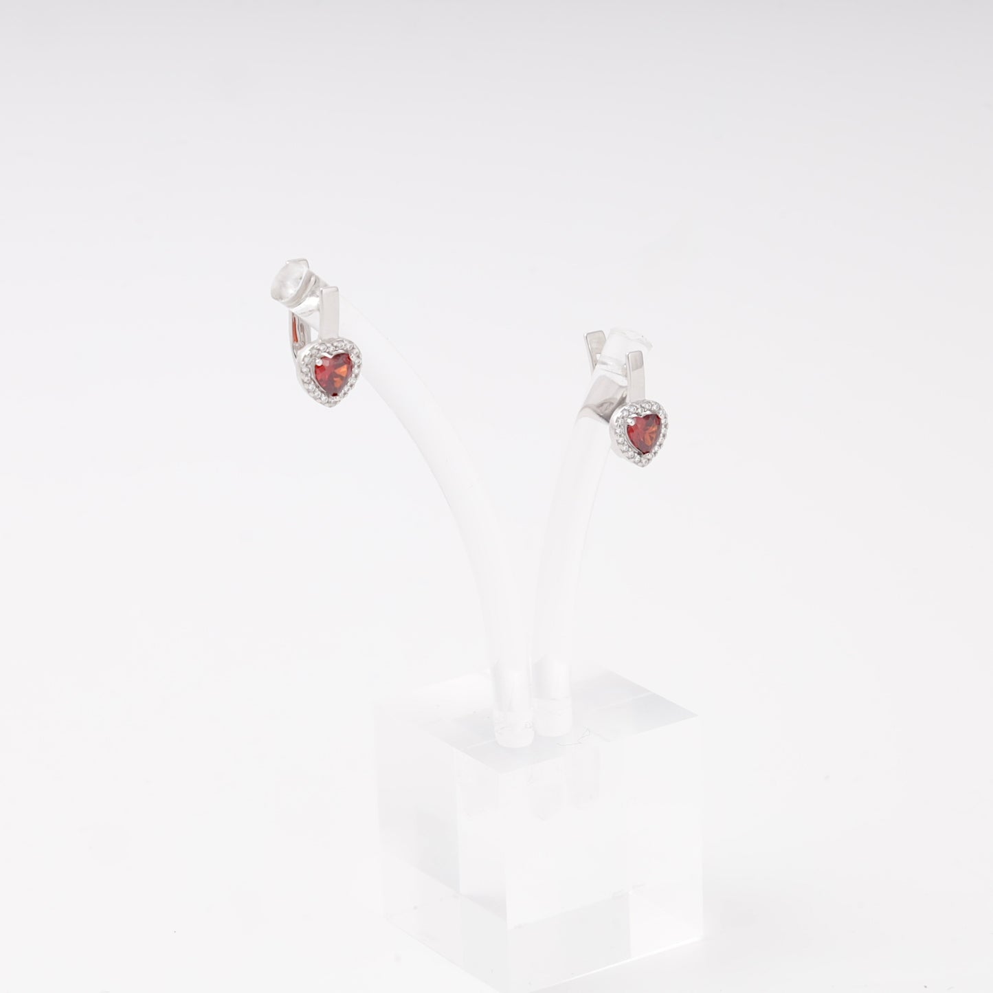 Silver 925 heart halo earrings shown on a stand — Kabluchka