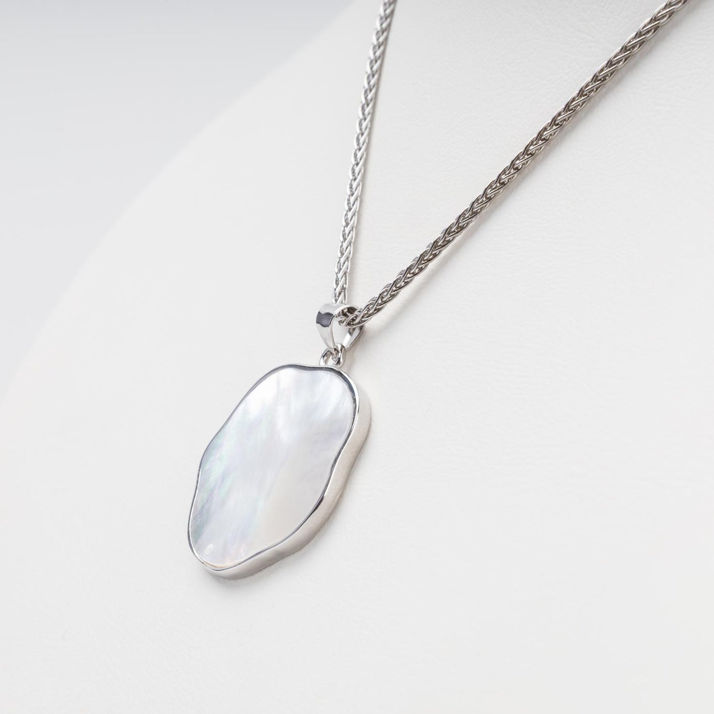 Natural mother-of-pearl pendant with silver bezel frame detail | Jewelry Store Kabluchka