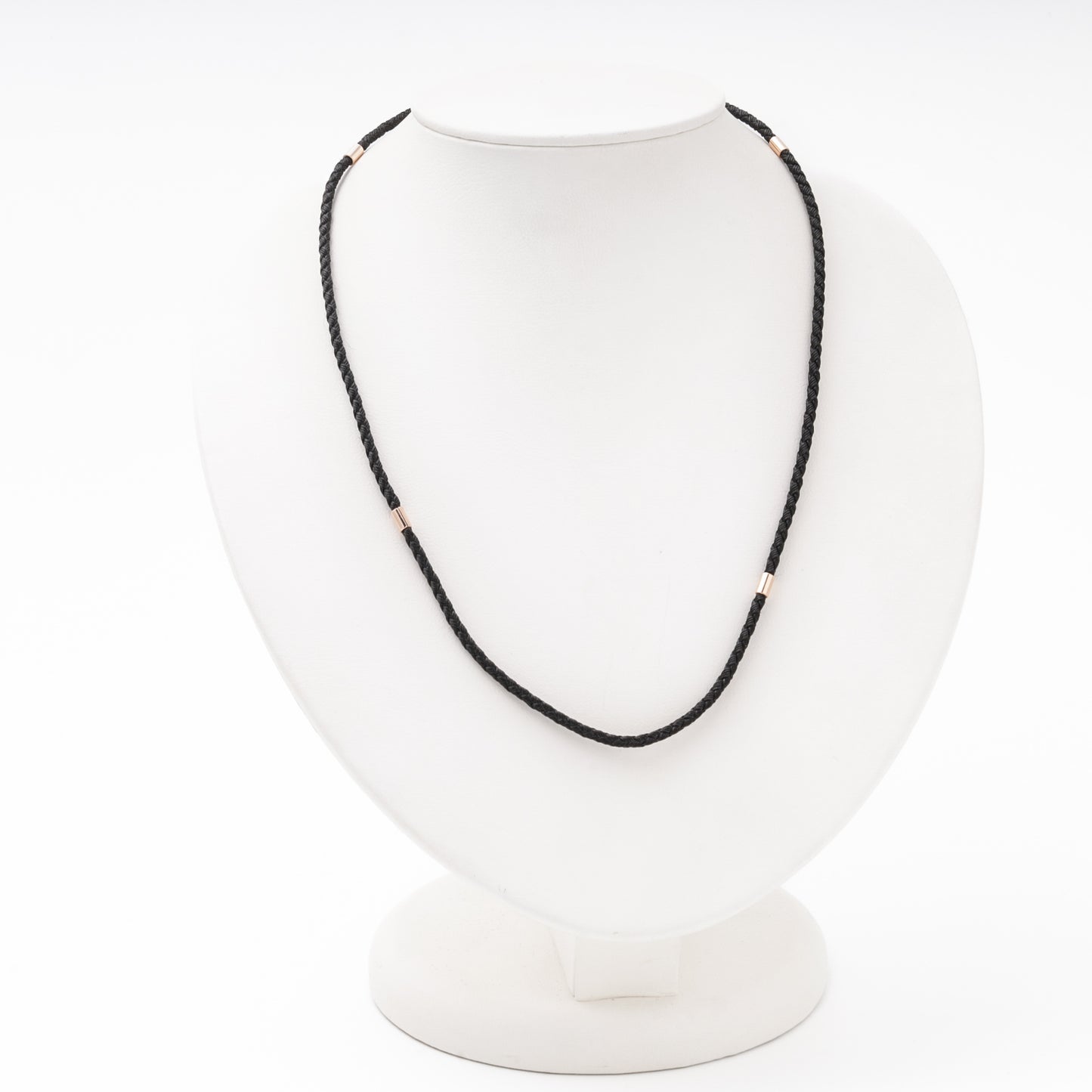 Black braided silk cord necklace with 14K rose gold fittings on bust — Kabluchka