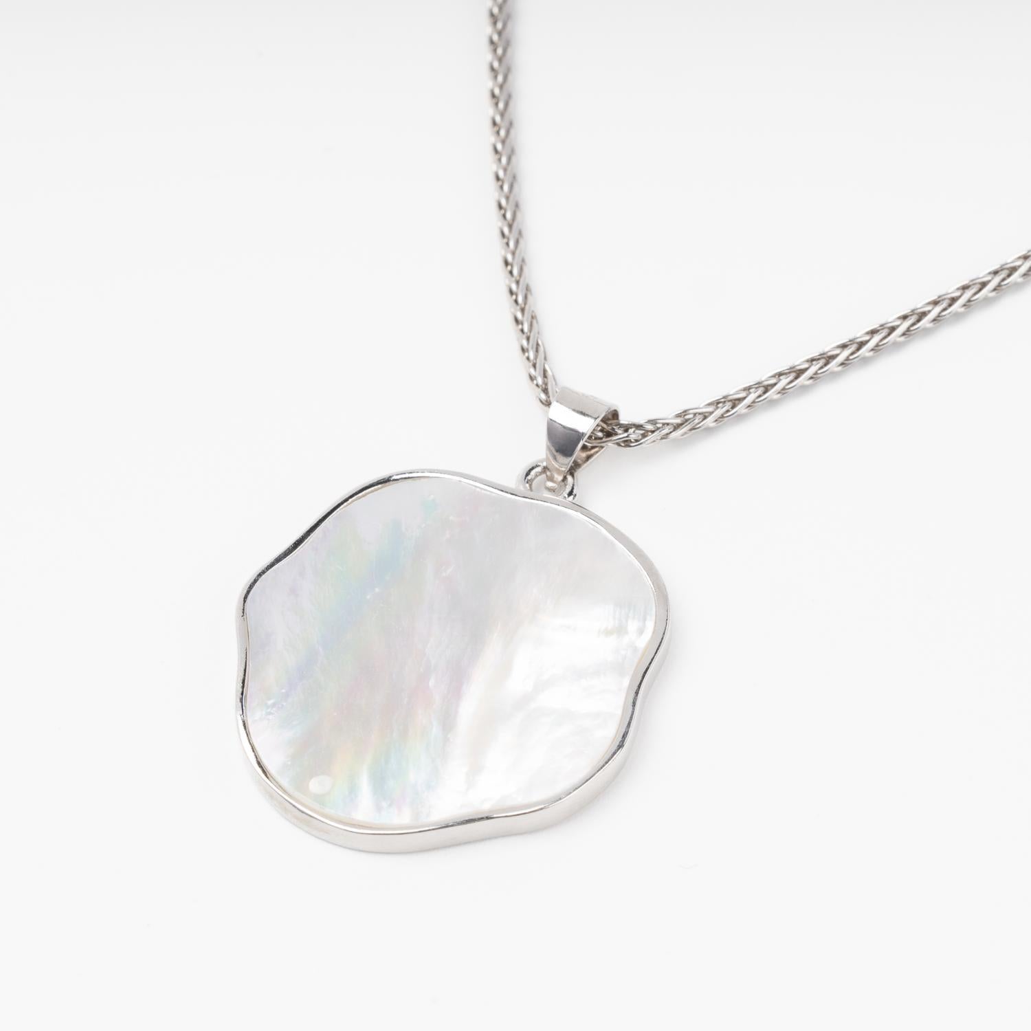 Silver 925 freeform natural mother-of-pearl pendant close-up | Jewelry Store Kabluchka
