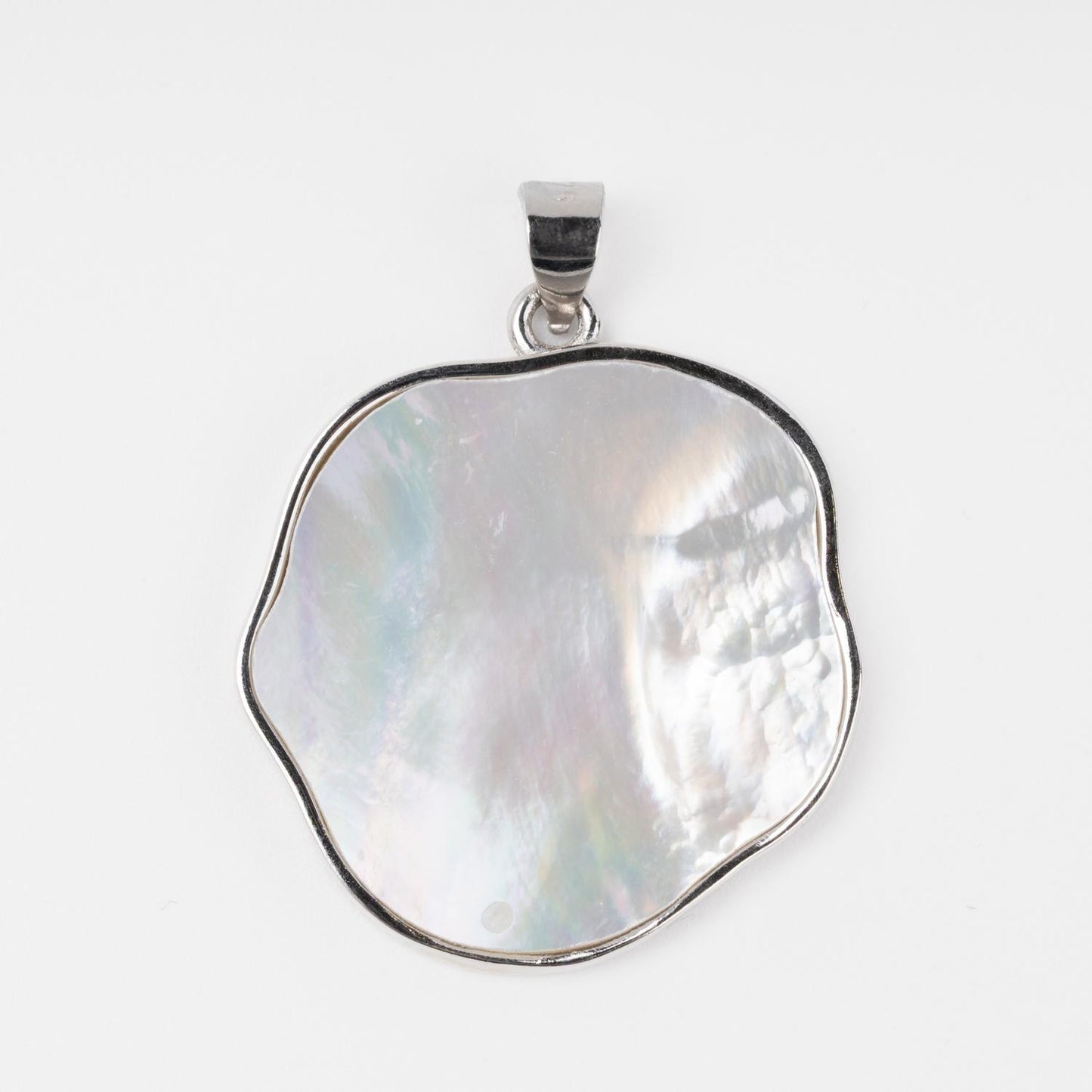 Silver pendant with organic shaped mother-of-pearl macro shot | Jewelry Store Kabluchka