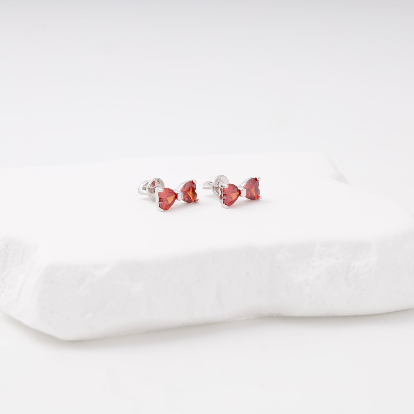 Red heart-cut cubic zirconia bow stud earrings — Kabluchka