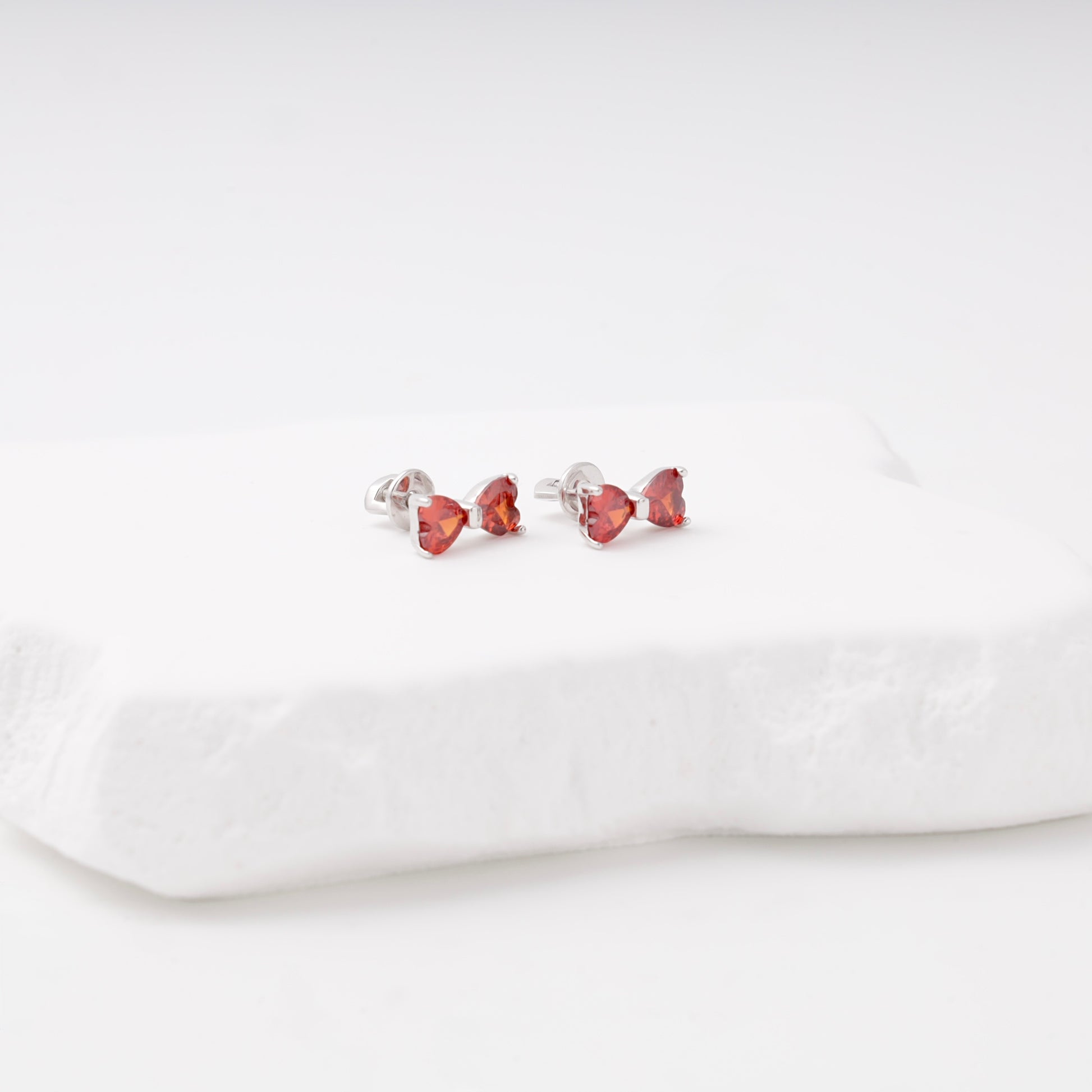 Red heart-cut cubic zirconia bow stud earrings — Kabluchka