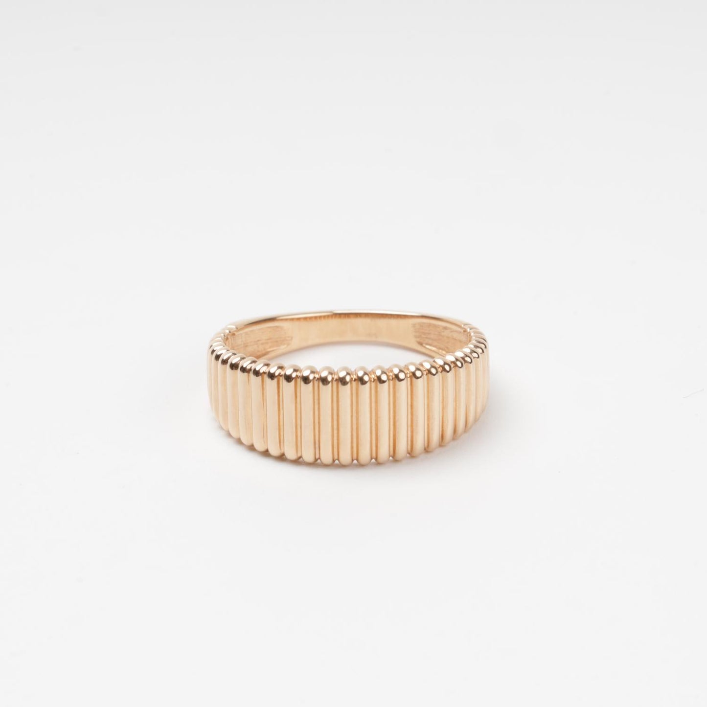 Sophisticated 14K (585) Rose Gold band ring featuring a continuous vertical ribbed texture with a high-polish finish, displayed on a clean white background.