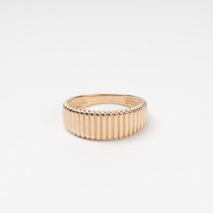 Sophisticated 14K (585) Rose Gold band ring featuring a continuous vertical ribbed texture with a high-polish finish, displayed on a clean white background.