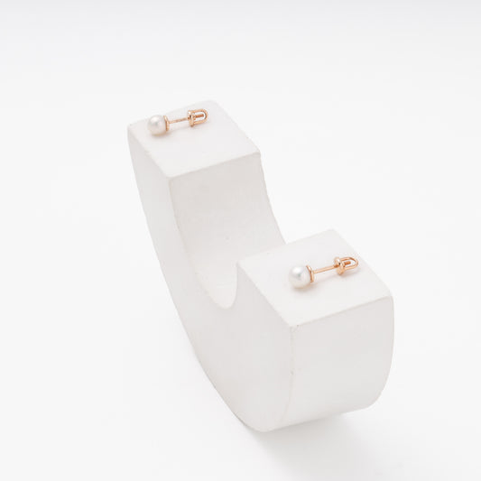 Rose gold pearl stud earrings 14K on display — Kabluchka