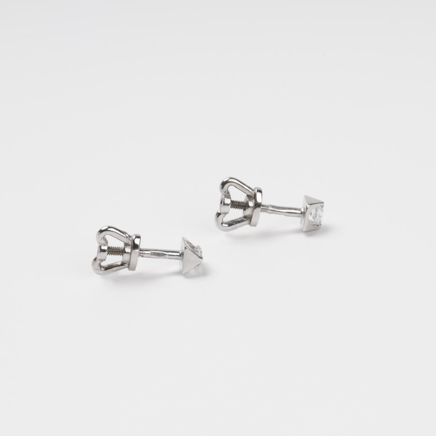 Technical close-up of 14K (585) White Gold stud earrings showing the high-security threaded screw-back post and the smooth white circular inlay.